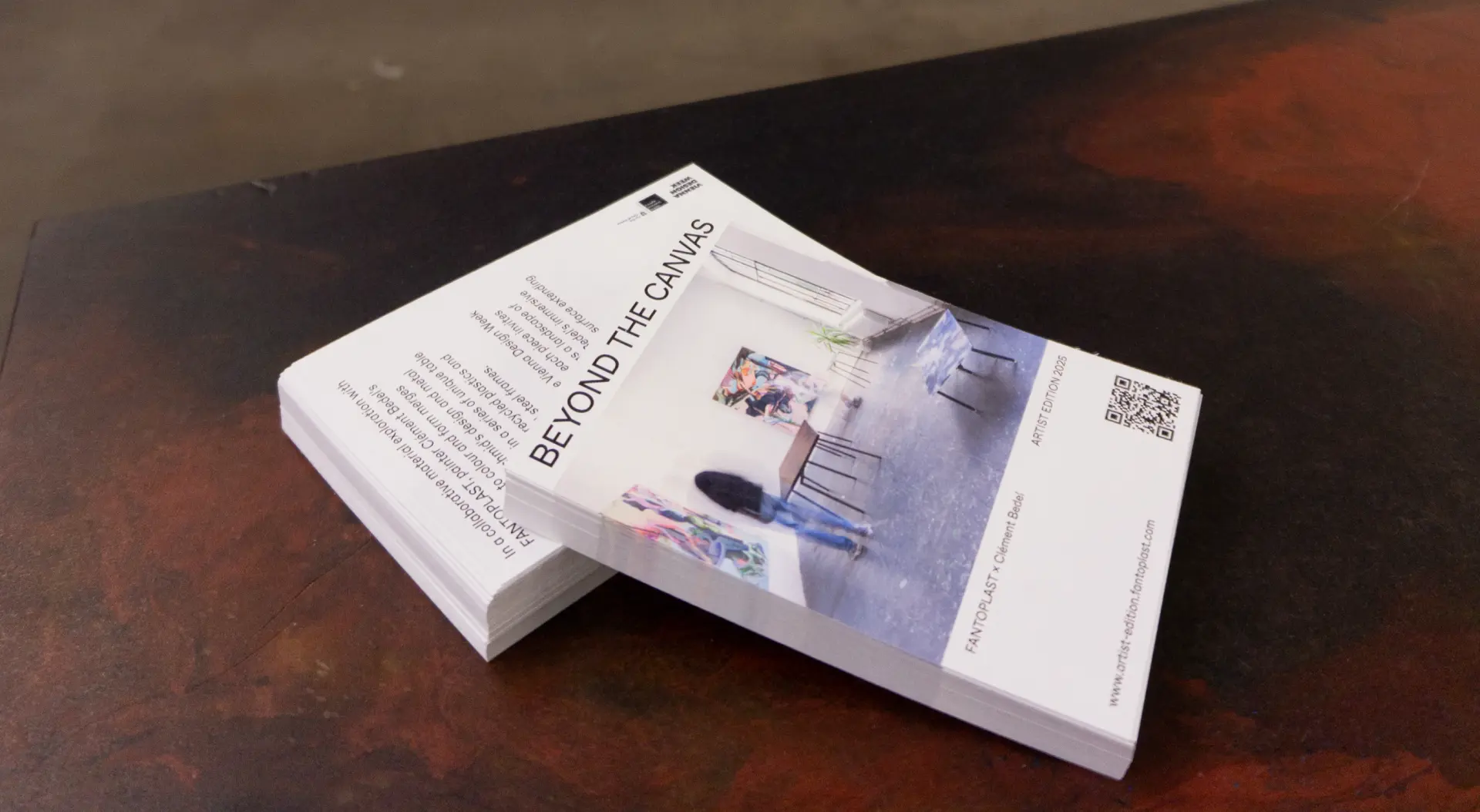 A photo of promotional postcards for the project Beyond The Canvas